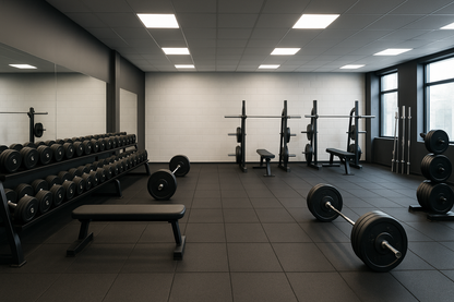 an empty gym with weights and dumbbells